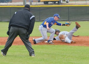 RWA shortstop Cameron Cooper swipes a late tag at FC’s Chris Boyd during the Griffins’ 14-0 rout of the Eagles Monday. (Photo/Ross Burton)
