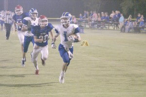 Webb Yongue (1) flies past the Raider defense. )Photo/Kay Hensley)