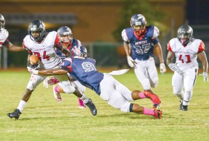 Westwood’s Rudy Mitchell (34) gashes the Demon defense Monday night. (Photo/Ross Burton)