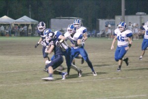B. Walters and Nic Stillwell smother Coastal Christian's David Ulmer. (Photo/Kay Hensley)