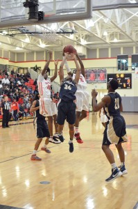 Westwood’s Adam Douglas (35) lifts the rebound from Trae Churn (34) as Jalen Robinson (20) makes a grab. (Photo/DeAnna Robinson)