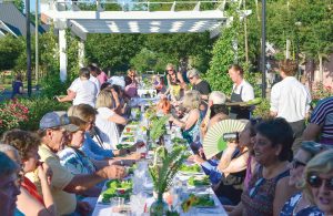 Around 75 people gathered for dinner last week on the promenade behind the Town Clock.