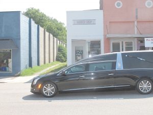 Gary Brown makes his last stop Saturday at his barbershop on Congress Street. (Photo/Barbara Ball)